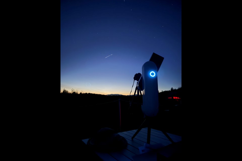 A cutting-edge combination of digital telescope and camera in use at the Sunshine Coast Observatory is silhouetted against orbiting satellites from the Starlink constellation.