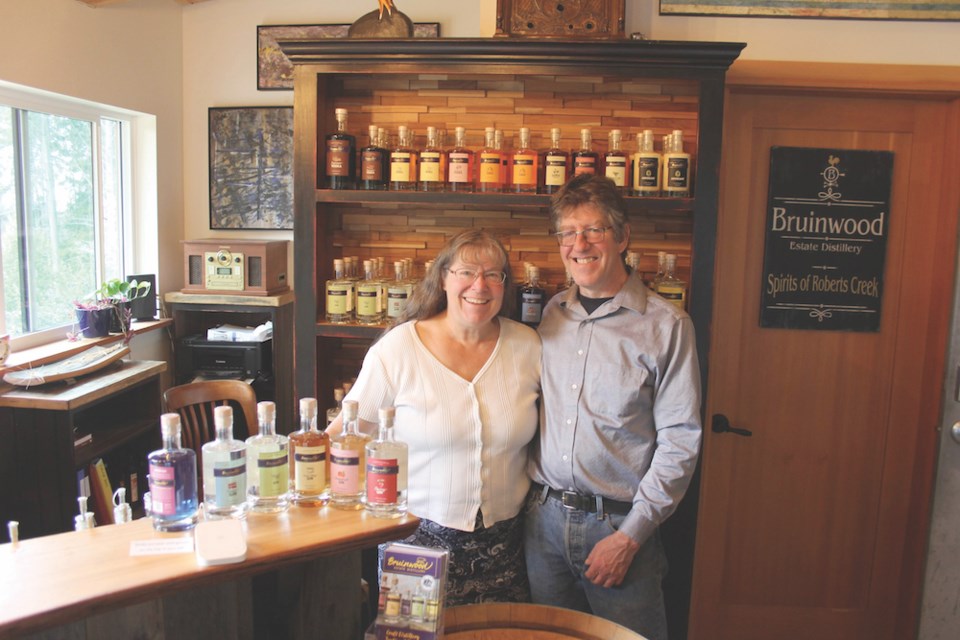 Danise Loffram and Jeff Barringer of Bruinwood Estate Distillery with an array of products.