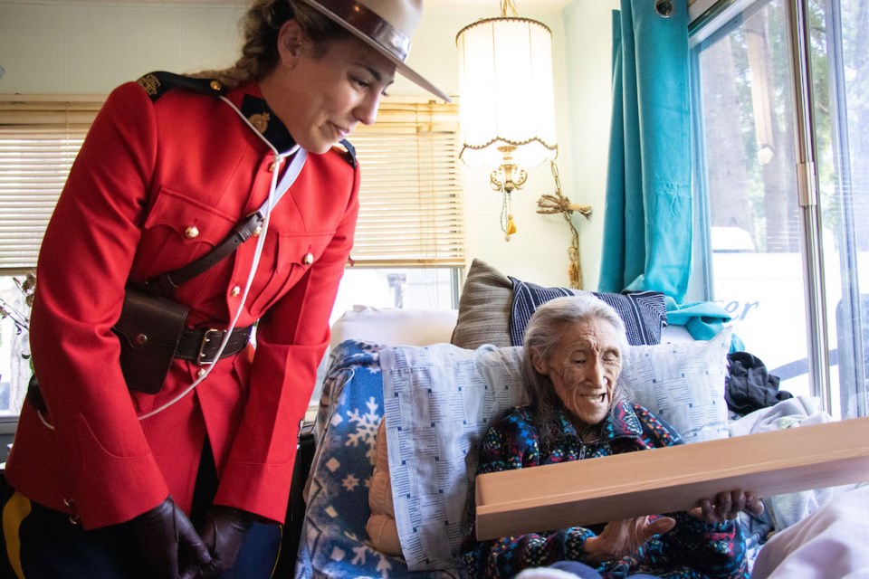 Sunshine Coast RCMP's Cst. Jihan McDougall with Annie Aculiak at her home on June 23 at a gathering to recognize her lifetime achievements. Annie died a few days later. 