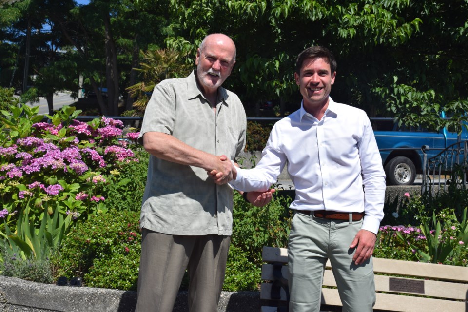 Gibsons Mayor Bill Beamish and West Vancouver—Sunshine Coast—Sea to Sky Country MP Patrick Weiler shake hands at Gibsons Pioneer Park. 