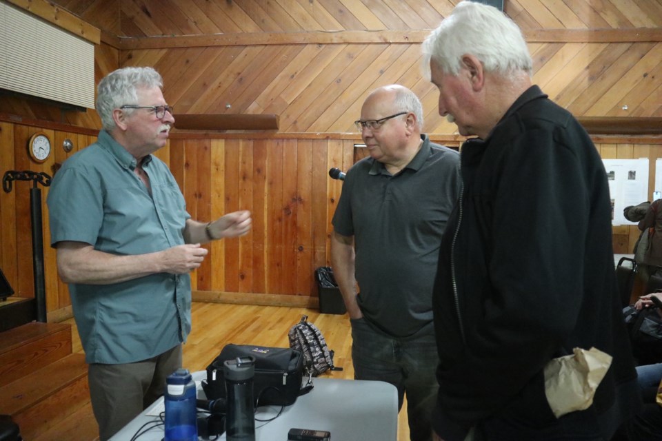 Peter Robson (left) president of the Pender Harbour and Area Residents Associations speaks with attendees following the group's Oct. 22 Town Hall Meeting.                         