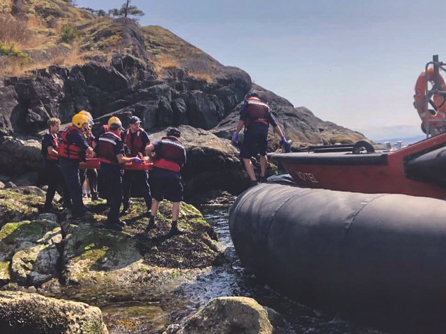 The injured person was carried over rough terrain and slippery rocks to the hovercraft.