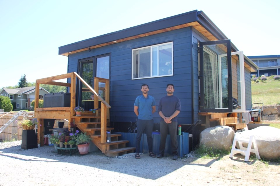 Rohan Kulkarni, the CEO and originator of Rohe Homes’s design, and Salik Khan with the first lived-in model.