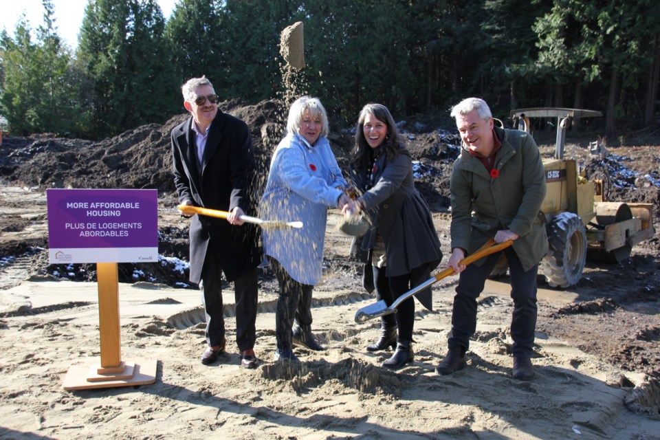 MLA Nicholas Simons, Donna Bell, Kim Darwin and Mayor Silas White complete the Shaw Road ground breaking ceremony with shovels of dirt on Nov. 8.