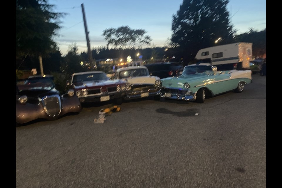 The scene after a '57 Chevrolet Bel Air struck two women and damaged three other classic vehicles on Aug. 8, 2025 in the Sechelt Inn parking lot. 