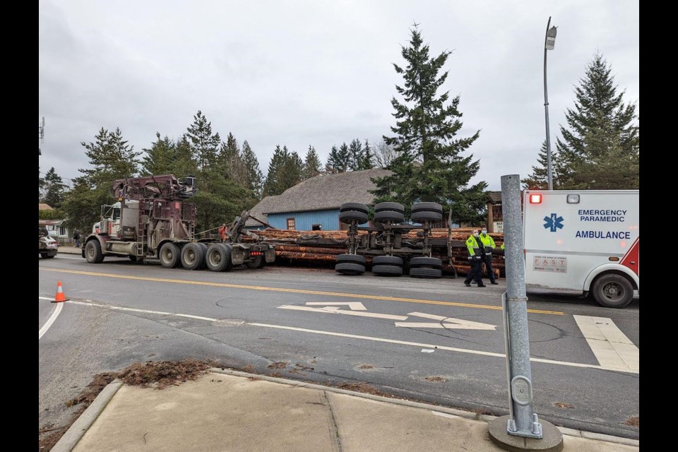 A logging truck trailer overturned by the Heritage Playhouse March 11. 
