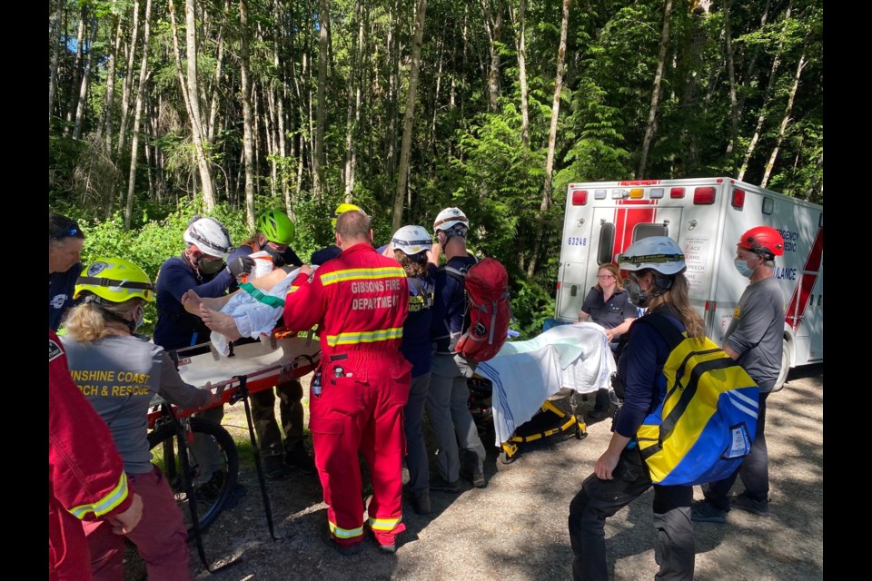 Sunshine Coast Search and Rescue volunteers helped two mountain bikers down trail in the Sprockids area to waiting ambulances. 