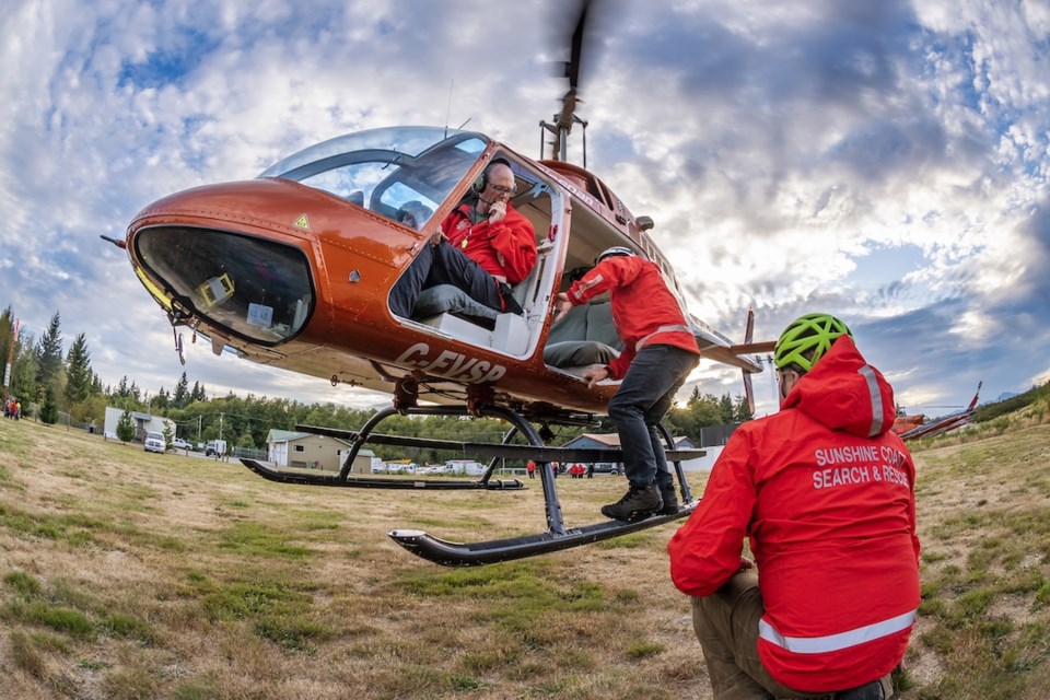 Search and Rescue people boarding a helicopter