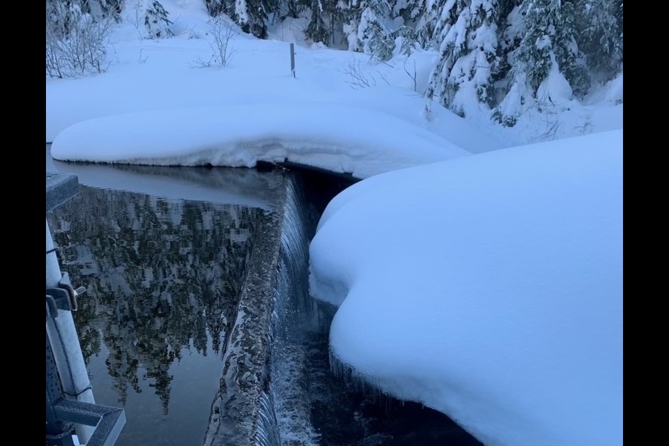 Chapman Lake is flowing over the dam after months of low lake levels.