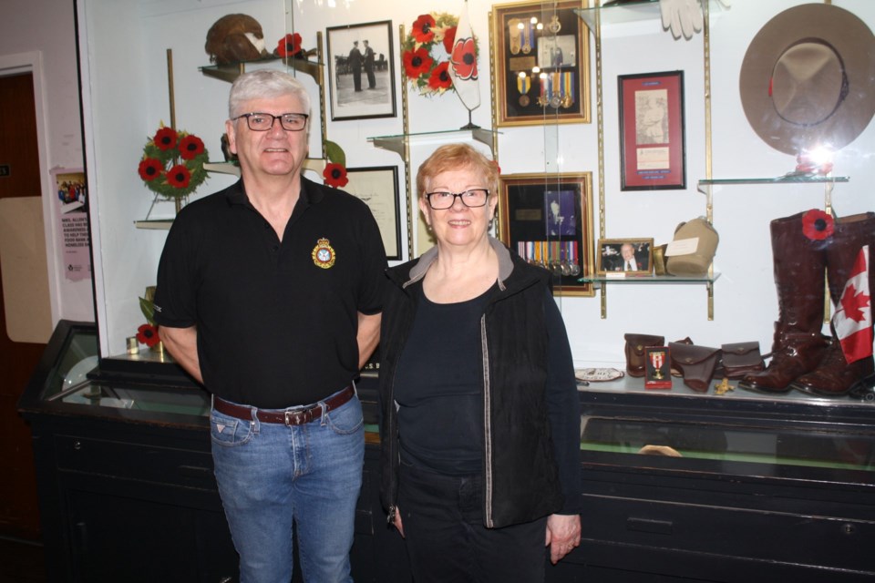 Sechelt Legion president Bill McLean and first vice-president Kathy Wishlow in front of the branch’s collection of memorabilia.