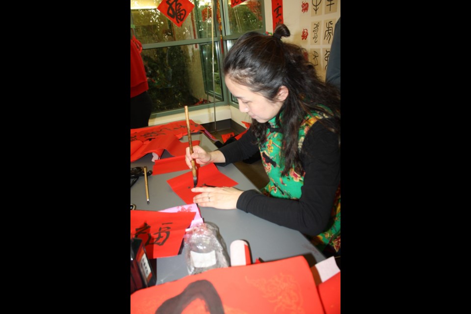 Liu Yang demonstrated the Chinese art form of calligraphy.
