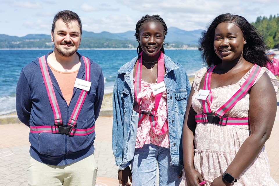 Reginald Bennett, Margaret Joseph and Susan Akol were the first to assemble at the parade site.