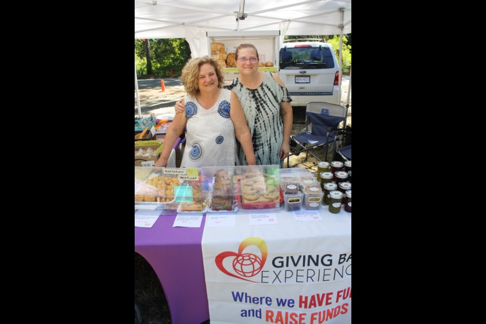 Taya Docksteader and Jo-Anne Kusnir sold home-made treats in support of Giving Back Experiences.