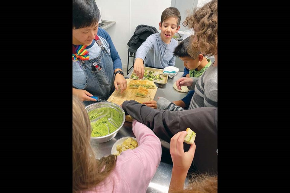 Nourish Eatery’s Cheryl Chang held cooking lessons for kids at the Sunshine Kitchen last week.
