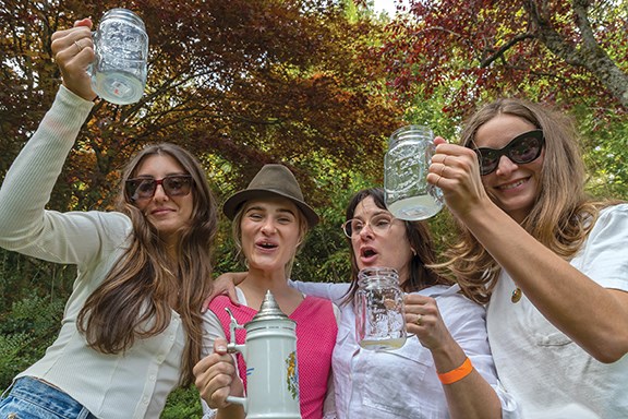 From left: Lea Faradian, Adelie Houle-LaChance, Renee Lachance and Coralie Kourany raise a glass at Oktoberfest to celebrate Adelie’s 30th birthday.