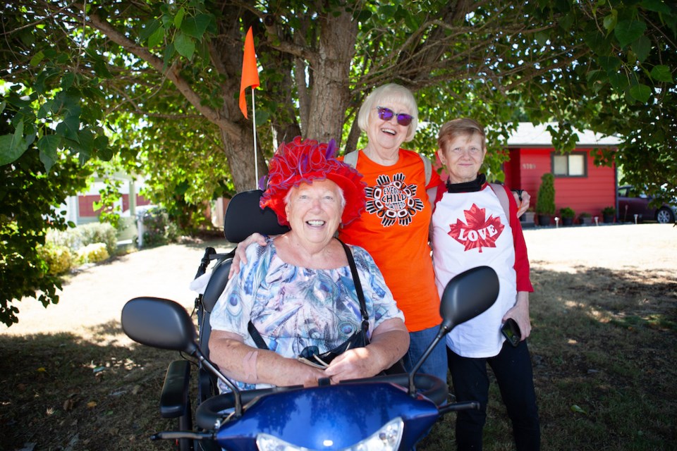 Edna Carley, Cauleen McCuaig, Shelley McCuaig viewed Sechelt’s Canada Day parade from a shady vantage point on Dolphin Street.