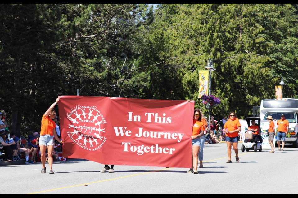 An orange shirt walk was at the head of the Canada Day parade. 