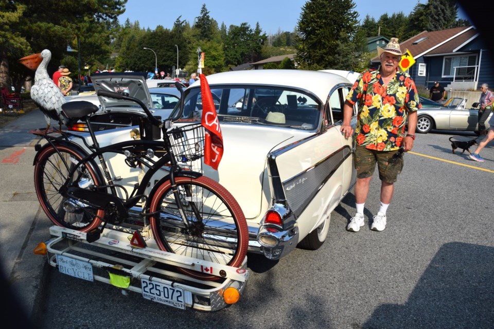 John Tommasini proudly showed off his vintage, “ermine white” Chevrolet Bel Air, at the Coasters Car Club's Show 'n' Shine event on Cowrie Street, Aug. 10.