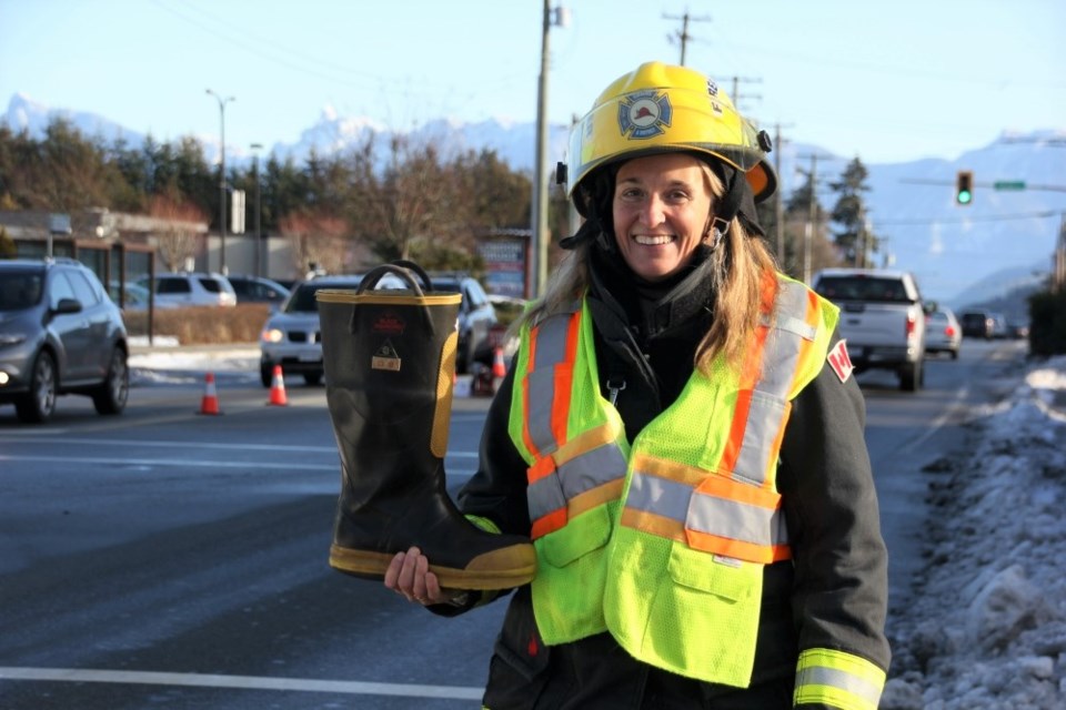 Gibsons firefighter Lisa Stiver has her gumboot ready to go.