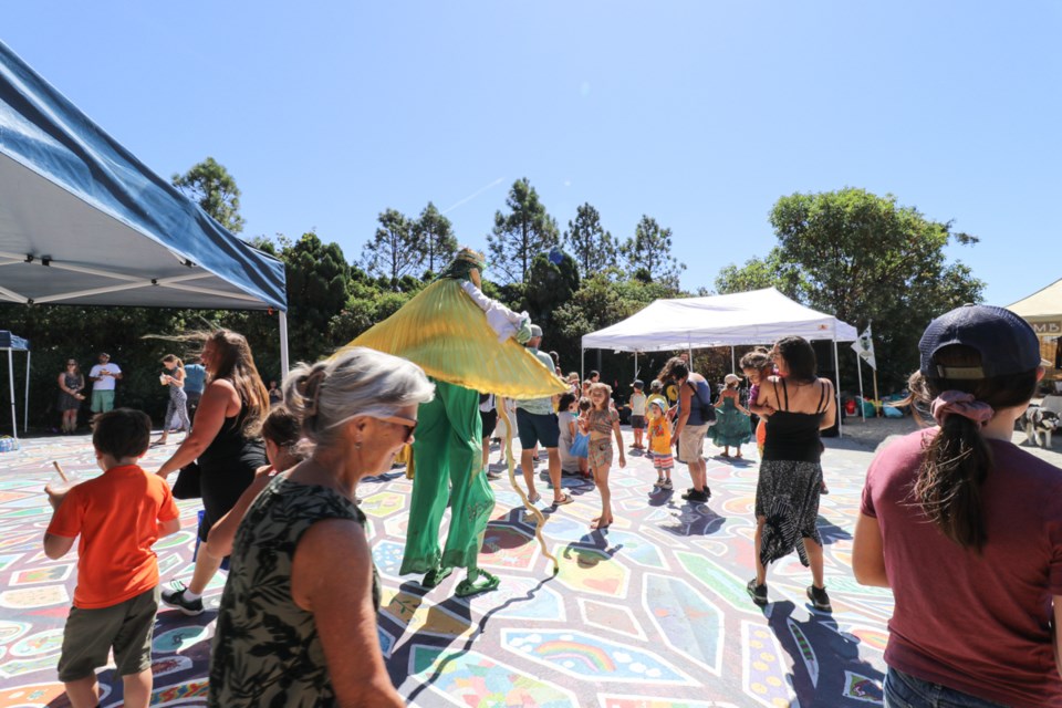 Kids jump and play to the music at the Roberts Creek mandala.