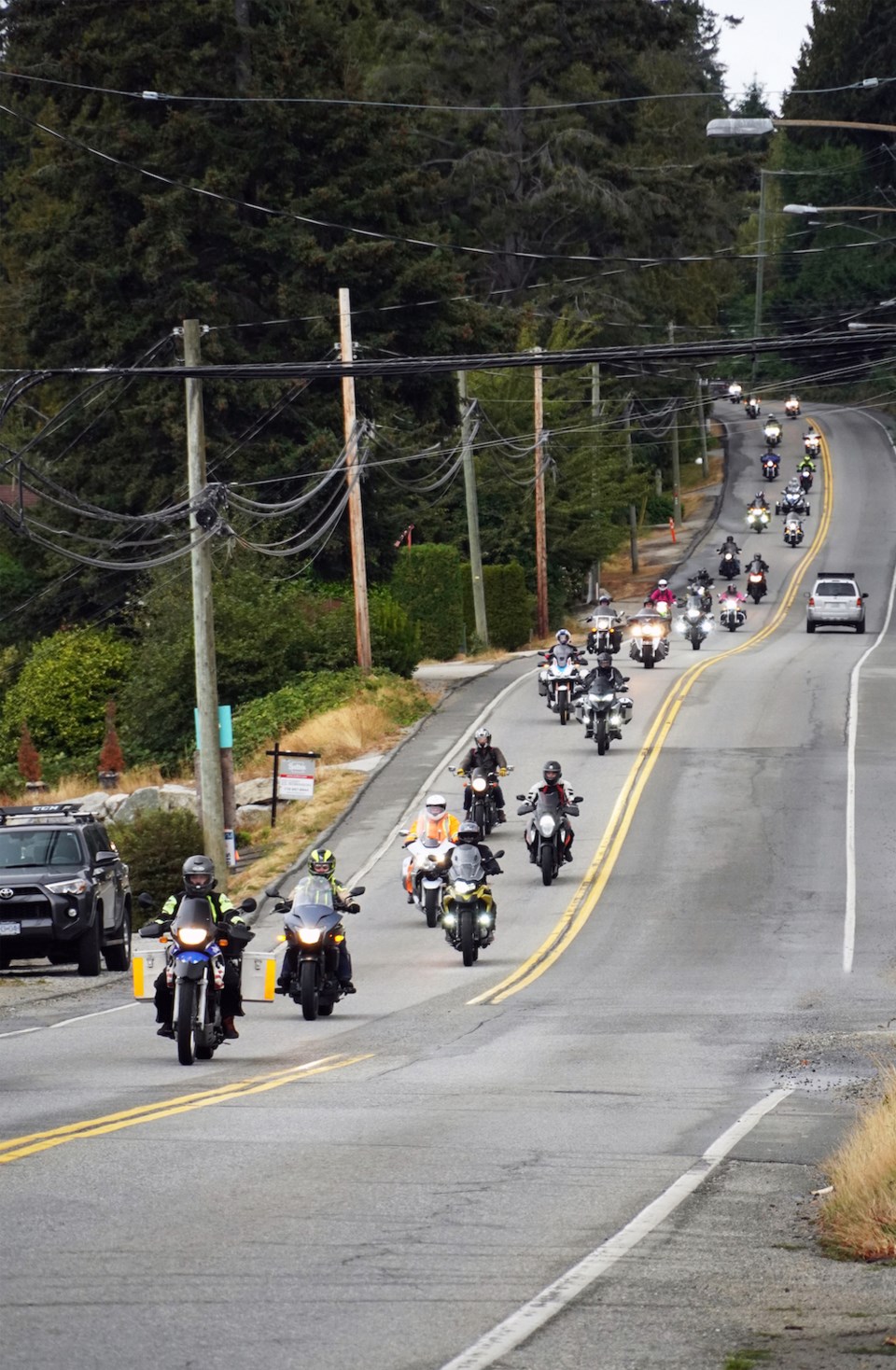 Motorbikes coming down Highway 101 into Davis Bay