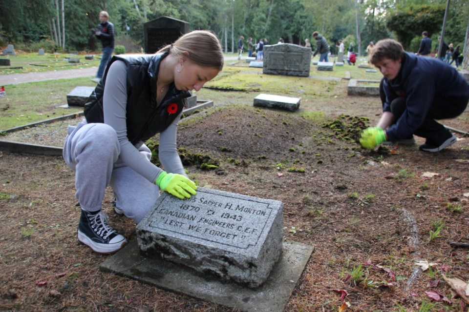 Polina Sydorova has lived on the Sunshine Coast since summer 2022, when her family fled the war in Ukraine. Cleaning veterans' graves makes her feel like she's "doing a good thing."