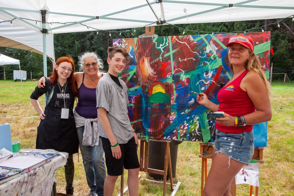 Vanessa Tomada, Marlene Lowden, Oscar Needoba and Kellei Baker (who provided first aid services) take part in the Freedom to Paint interactive art demonstration.