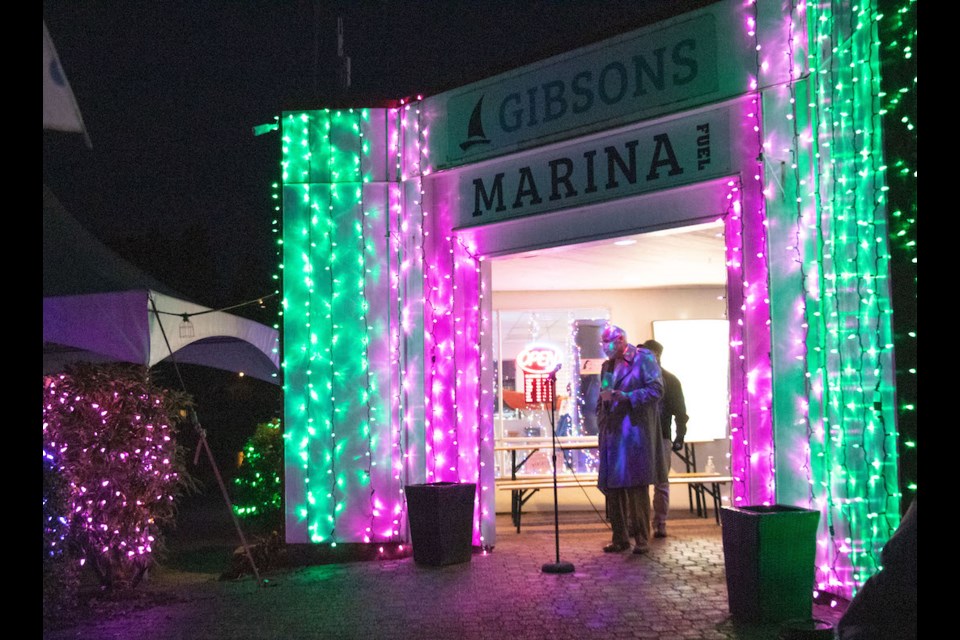 There was no switch to flip for Gibsons Marina's Klaus Fuerniss (there were a few thousand too many lights for it all to come down to one switch) but Fuerniss greeted the dozens of people who crowded down to the marinaside Nov. 18 for the display's opening. Fuerniss started Sea of Light shortly after buying the marina in 2015. 