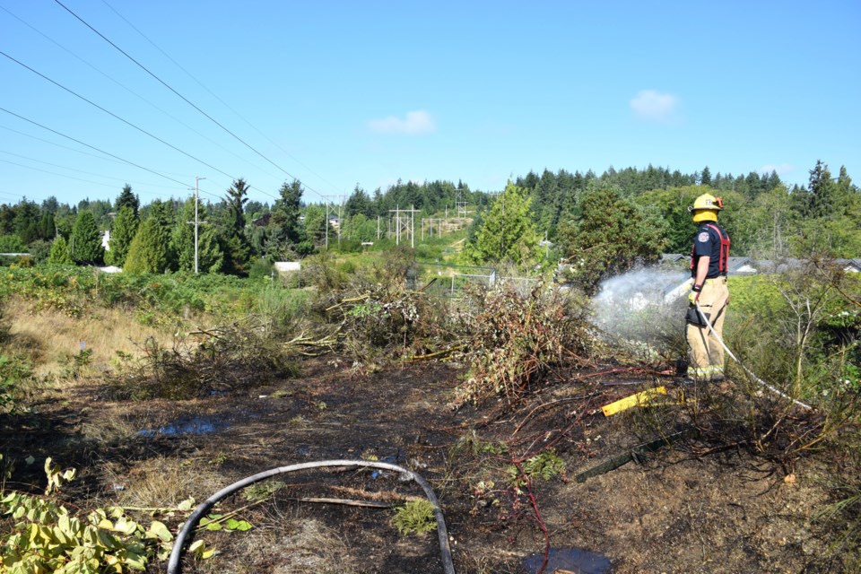The Sechelt Fire Department responded to a bush fire between Hightide Avenue and a townhouse complex, July 23.