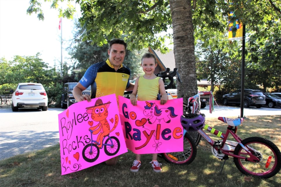 Cst. Chris Mager of the Sunshine Coast RCMP and five-year-old Raylee are raising money for cancer research. 