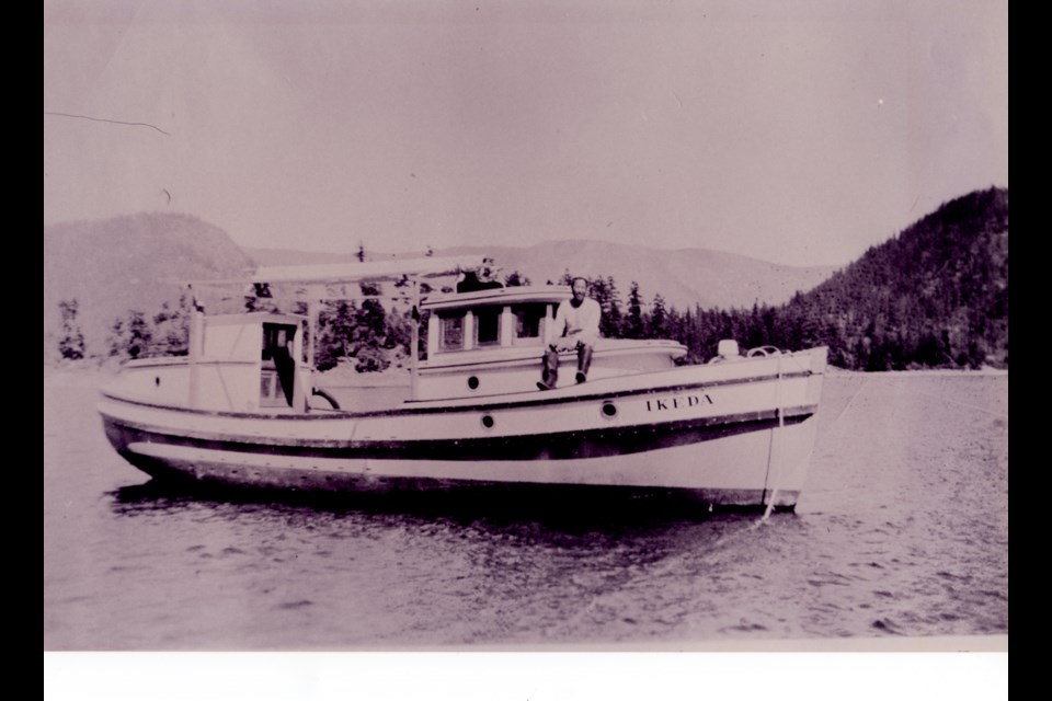 Torakichi Ikeda on his boat MV Ikeda in Pender Harbour. The photo was taken between 1926 and 1935.