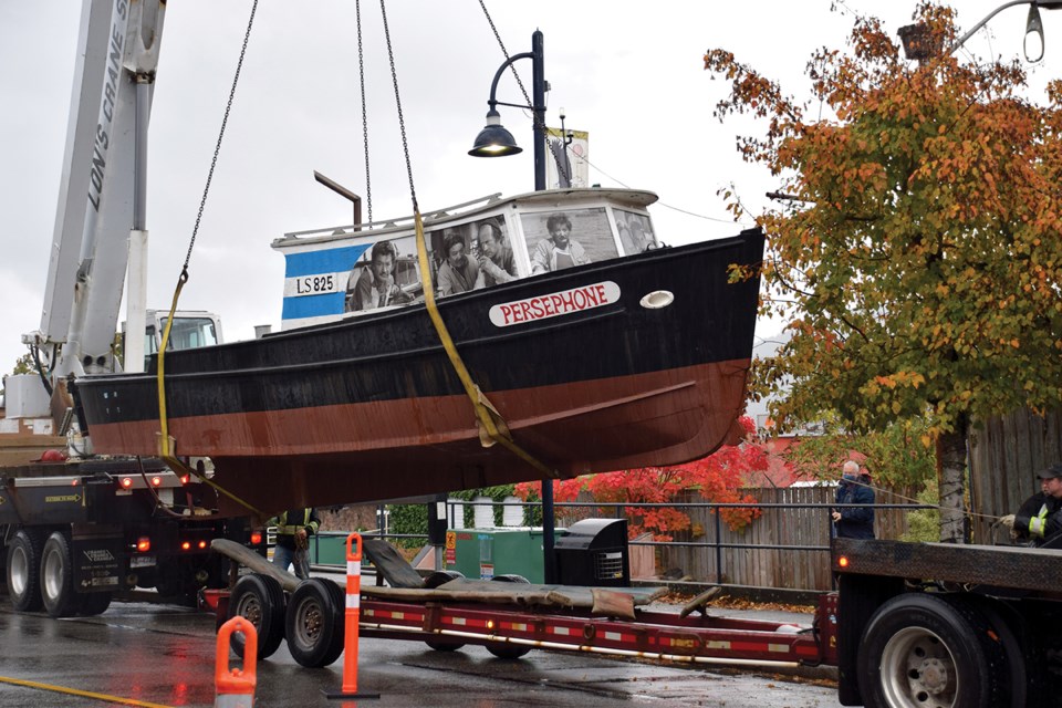 The Persephone is lowered onto the back of a waiting truck on Oct. 20.