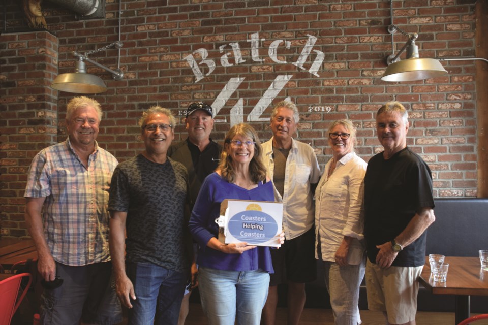 Coasters Helping Coasters is helping pair volunteers with Sechelt businesses who are short-staffed. Left to right: Jim Neilson, Guatam Rakhit, Joe Sawer, Lezlie Smith, Geoff White, Sandy Kay, and Brian Coxford. Volunteers Caroline Minchin and Bev Coxford are absent from the photo.