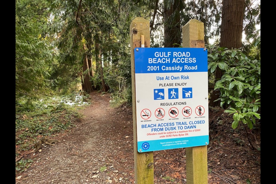 Residents in Roberts Creek have noticed that a sign was recently erected at the Gulf Road beach access that warns that the trail cannot be used between dusk and dawn. (Pictured is the beach access.) 
