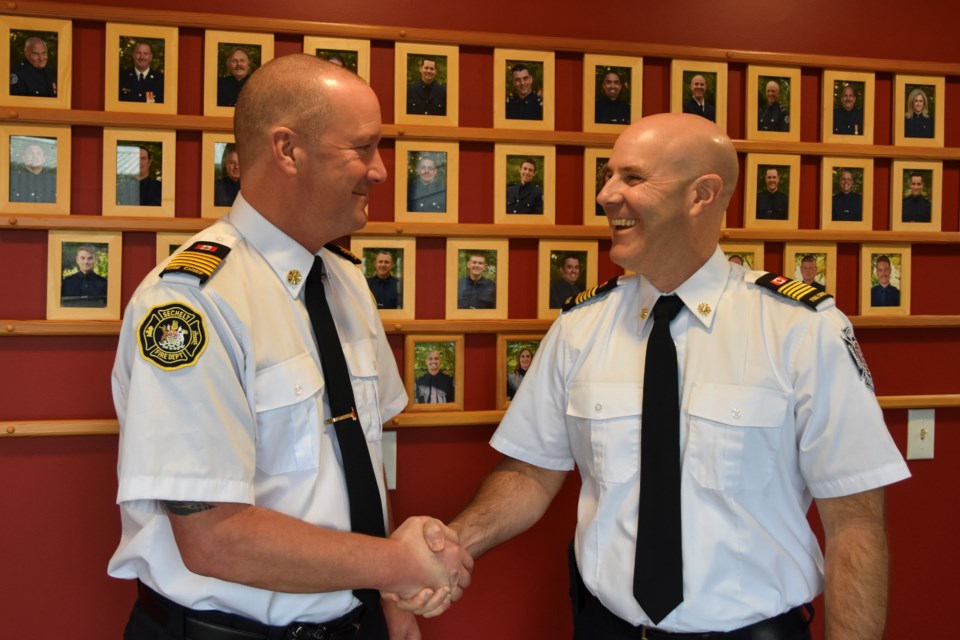 Trevor Pike alongside the new fire chief, Dwight Davison at the Sechelt Fire Department