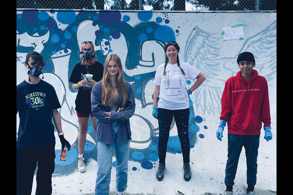 William Blackmon, Ainsley Shields, Zoe Broughton, art teacher Emily Gray, and Aedrian Salazar prepare to bring their designs to life.