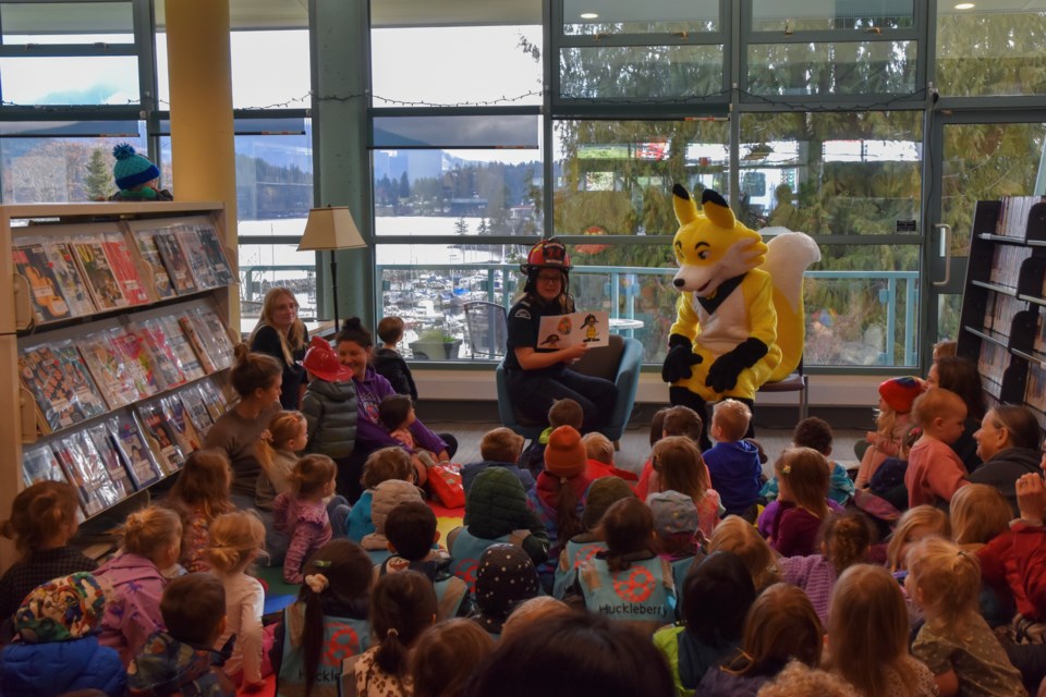 Erin Wilson, FireSmart representative and Halfmoon Bay firefighter led the more than 40 children in story time, and some fire related sing-along songs.