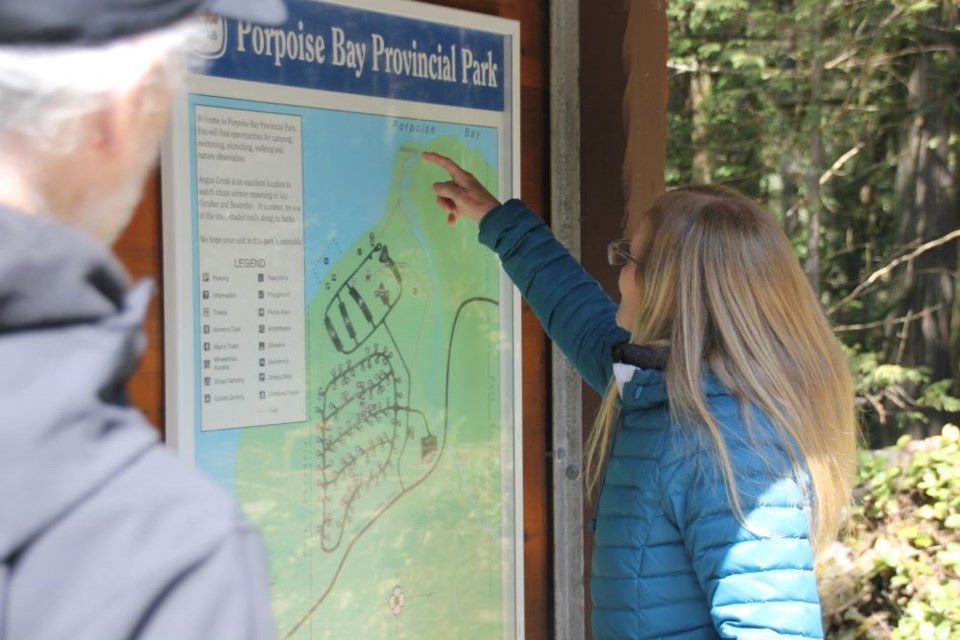 Jennifer Lake Tipper points to one of the possible areas where her mother, Rhody Lake, was thought to have gone the day she went missing in 2005.