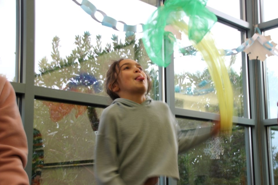 The room was full of colourful toys to toss around as Isla Burton learned how to juggle at the Gibsons & District Public Library on Jan. 6. 