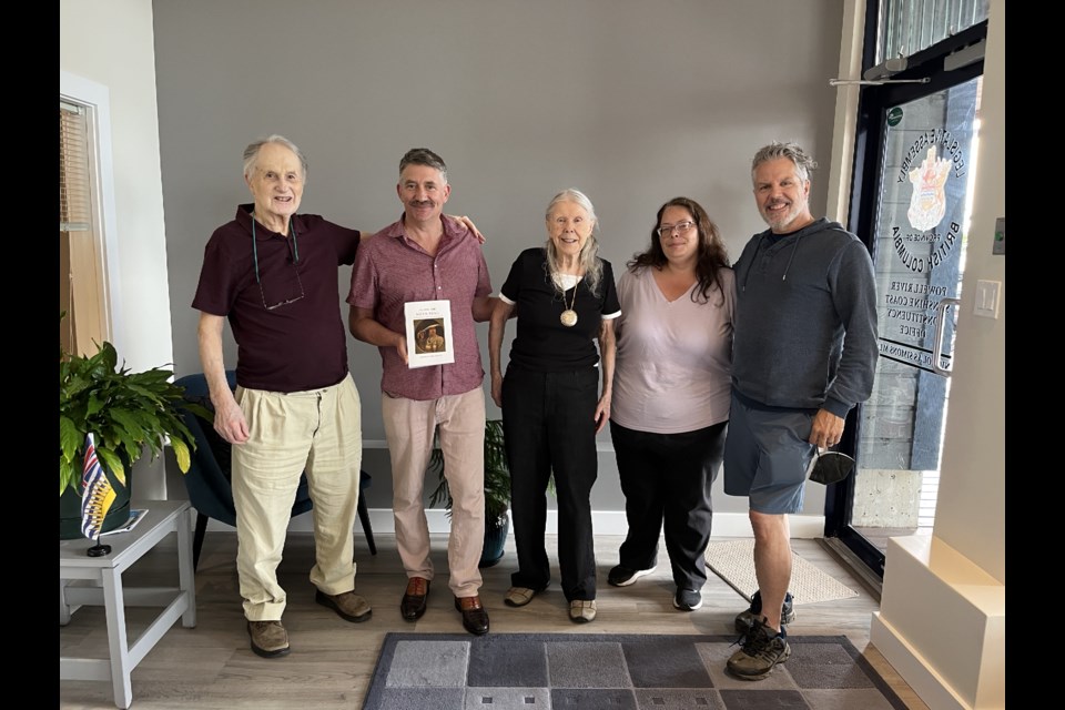 Special presentation: On Aug. 10, Metis authors presented Powell River-Sunshine Coast MLA Nicholas Simons with a copy of their new book Along the Metis Trail, Metis History, Heritage, and Culture at his Sechelt office. Left to right: Metis author George Goulet, MLA Nicholas Simons, co-author Terry Goulet, office assistant Kim Tourat, and the Goulets’ son John McDougall-Goulet.