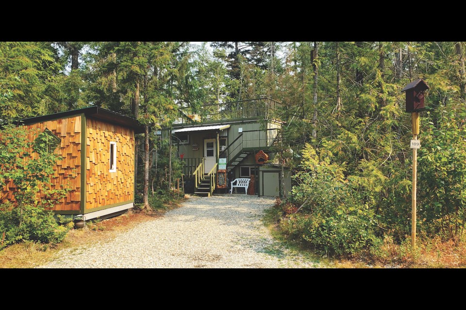 The 320-square-foot tiny home is located on an RV park, next to a provincial park, and uses the local natural resources for privacy. 