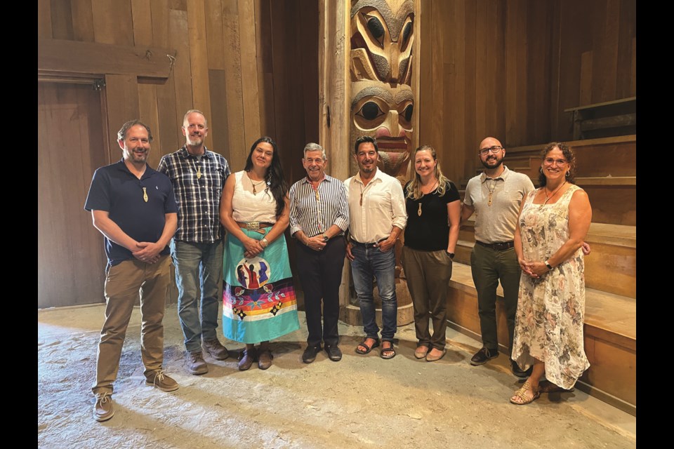 Members of Raven Indigenous Capital Partners and Salish Environmental Group celebrated a new investment of $2.5 million at the shishalh longhouse. (From right to left) Stephen Nairne (Raven), Chris Lynn (Salish Operations Manager), Jacqueline Jennings (Raven), John Sutherland (Salish), Aaron Joe (Salish), Shawna van Poppelen (Salish) Mitch Langen (Raven), Rinette Lagace (Salish).