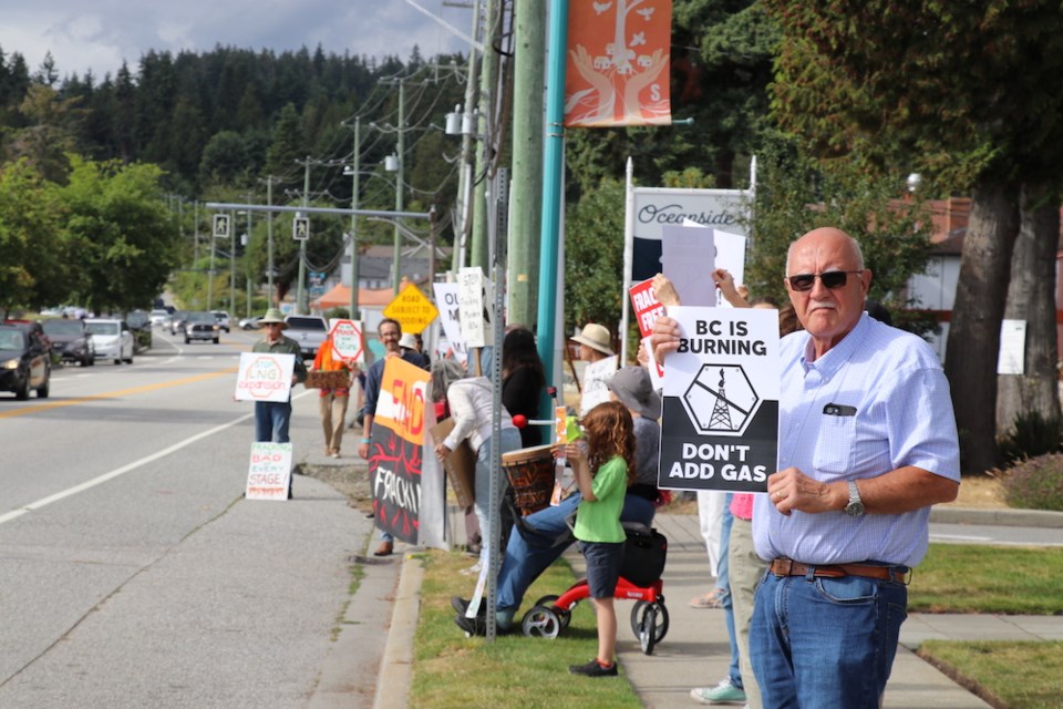 Anti-fracking demonstrators gathered on the steps of MLA Nicholas Simons' Sechelt office on July 23.