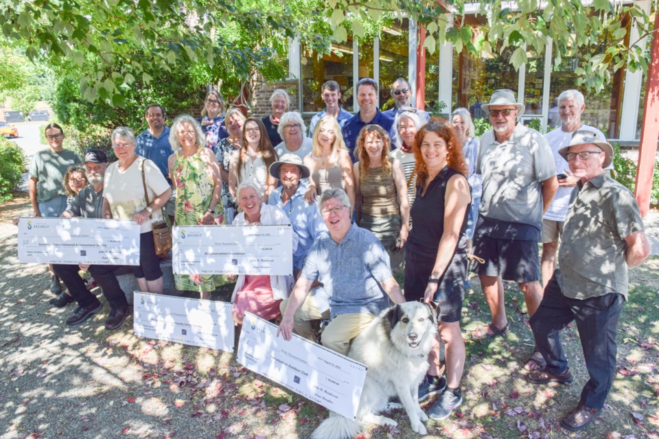 Representatives from Sunshine Coast Community Forest, District of Sechelt, Pender Harbour Community School, S.C. Salmonid Enhancement Society and BC Conservation Association gather for cheque presentations on Aug. 15. 