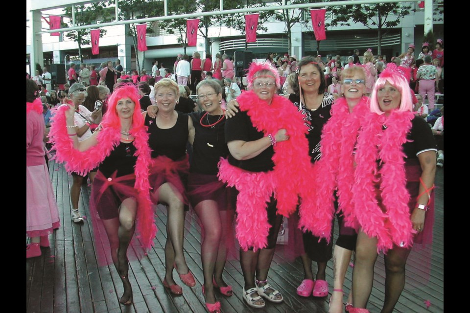 Some of those original Sunshine Dragons Abreast paddlers in 2005 enjoying the first International Breast Cancer Dragon Boat Festival.