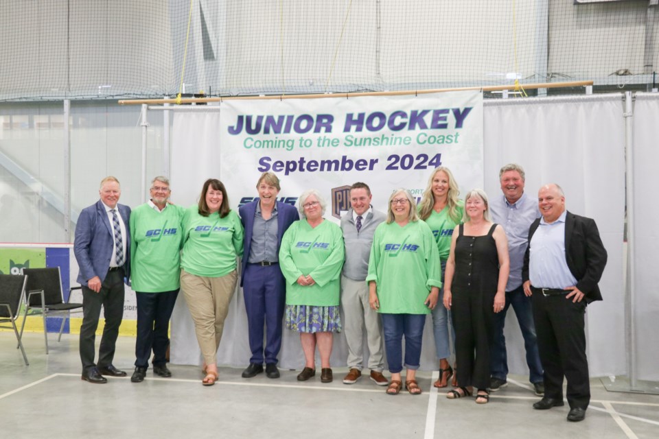 Celebrating a new team: Sunshine Coast Junior Hockey Society board and staff members, new franchise owners, league representatives and other officials celebrate the Sunshine Coast's new hockey team.