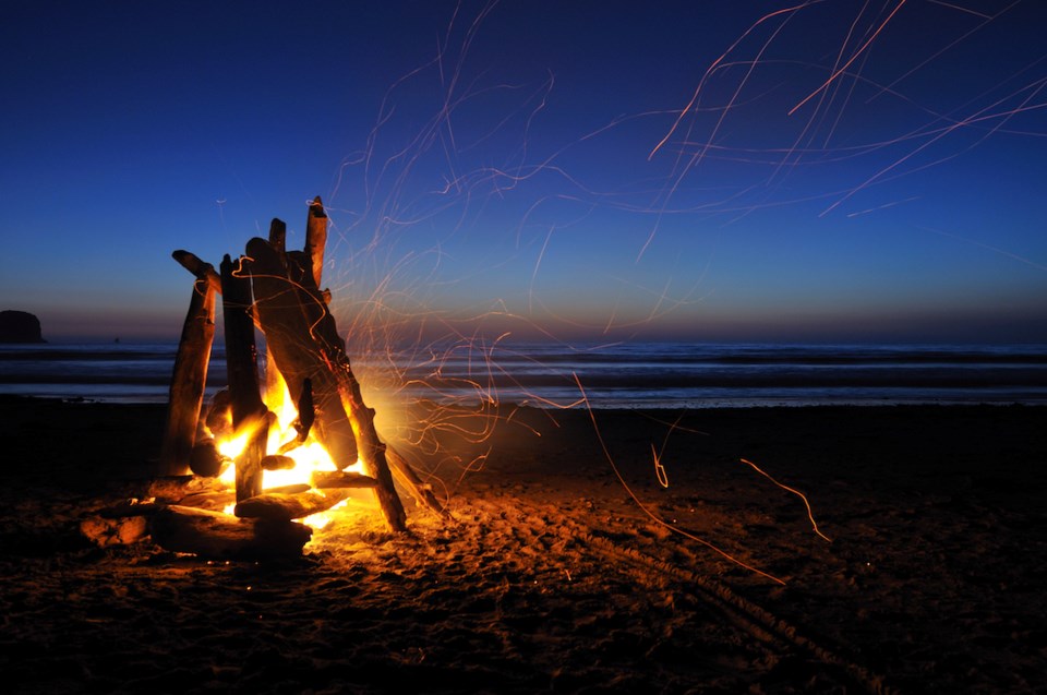 A campfire on the beach