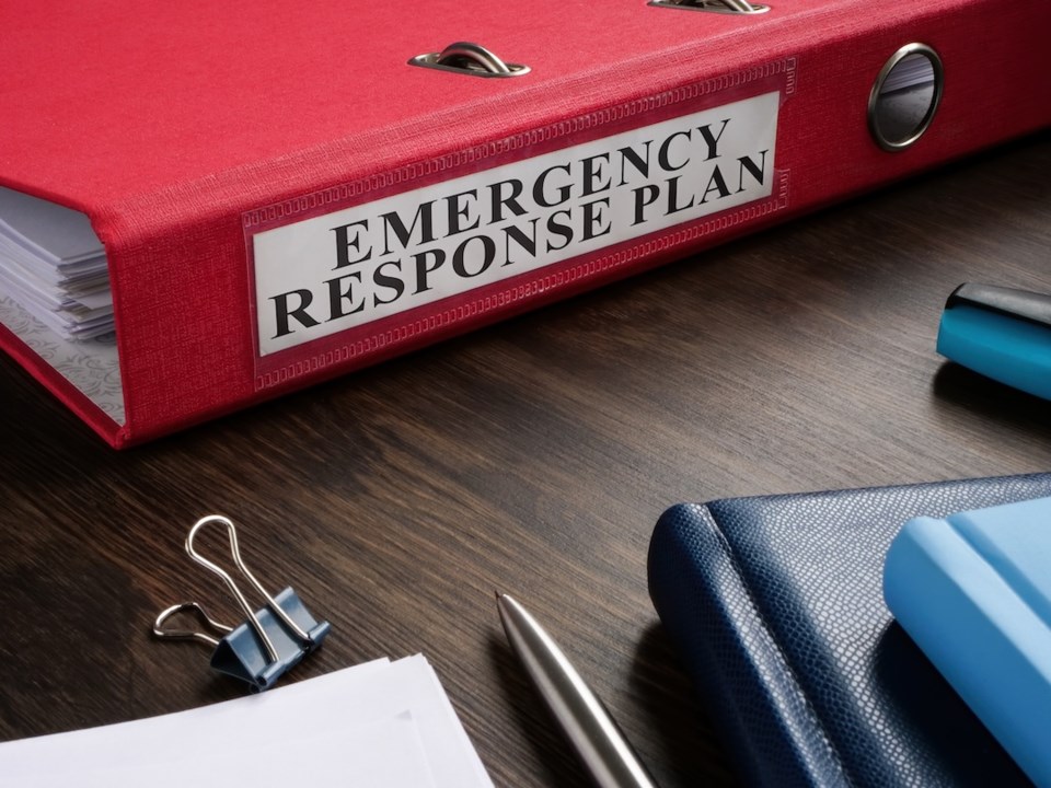 a-red-folder-with-emergency-response-plan-on-the-desk