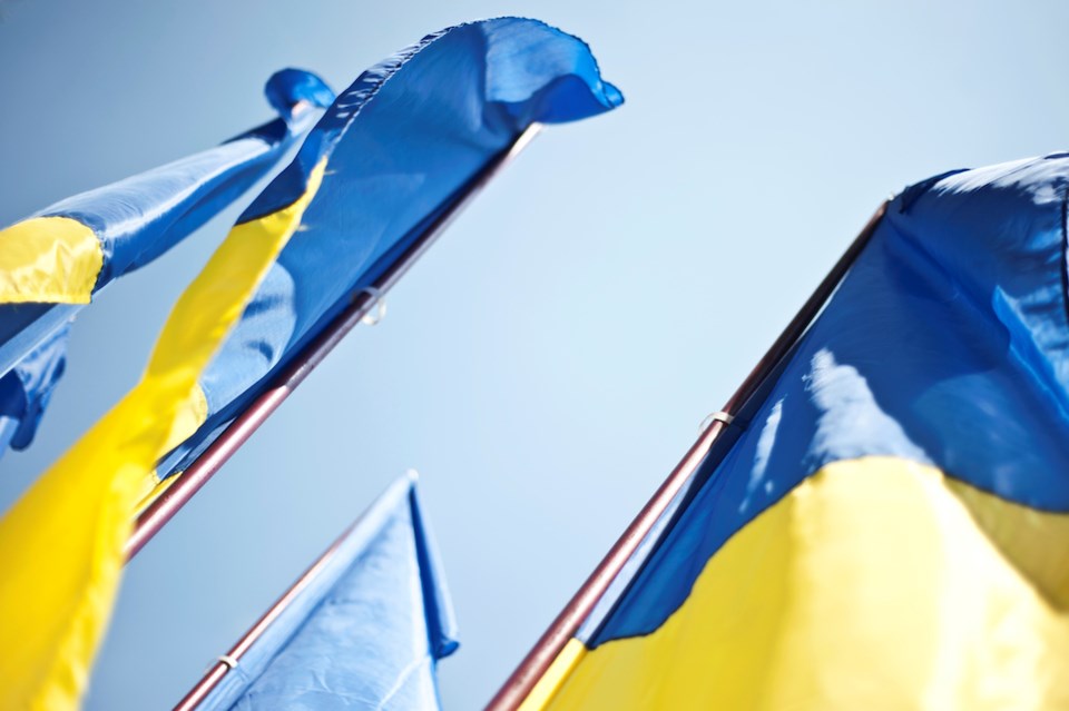 A trio of Ukrainian flags