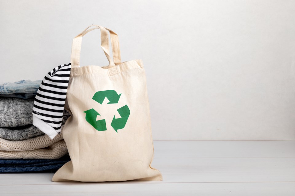 Bag with recycling arrows on it and a sock hanging out